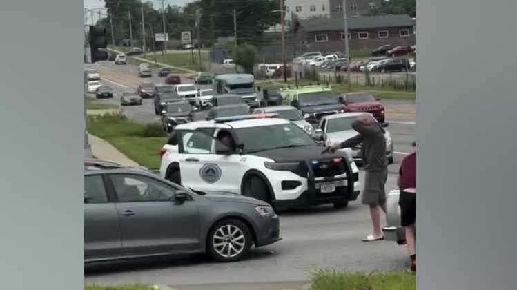 WATCH: Video shows armed man pointing gun toward car after crash in Des Moines